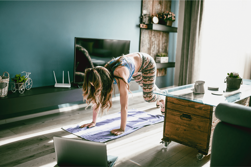 woman exercising at home for mental health benefits