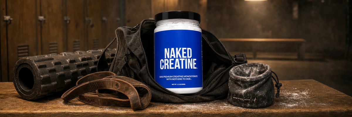 Naked Creatine tub in a gym bag on a locker room bench surrounded by workout gear
